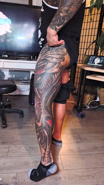 Full leg sleeve. Flowing ornamental work, hip to foot.