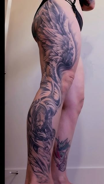 Wing leg sleeve. Feathers and ornament wrapping hip to ankle.